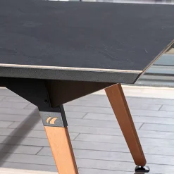 Cornilleau Outdoor-Tischtennisplatte|Outdoor Tischtennnisplatte Origin Dark Stone Oberfläche mit schwarzem Rahmen